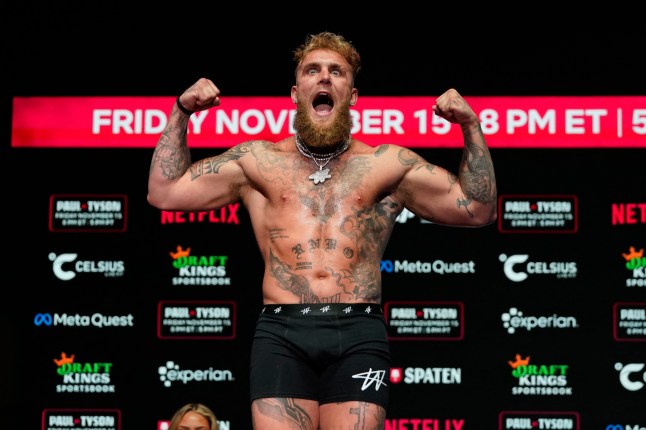TOPSHOT - US boxer and actor Jake Paul gestures during his weigh-in ahead of his heavyweight boxing match against Former US heavyweight boxing champion Mike Tyson in Irving, Texas, on November 14, 2024. (Photo by TIMOTHY A. CLARY / AFP) (Photo by TIMOTHY A. CLARY/AFP via Getty Images)
