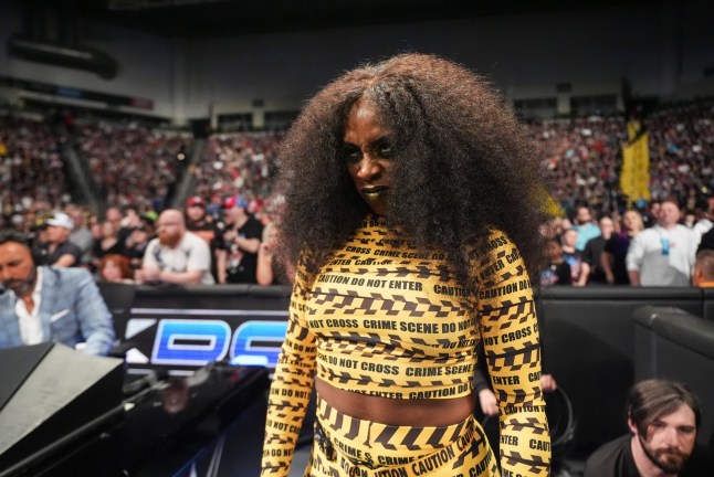 Naomi looks on during WWE SmackDown