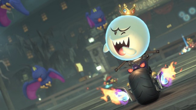 Mario Kart World King Boo laughing while driving a bike