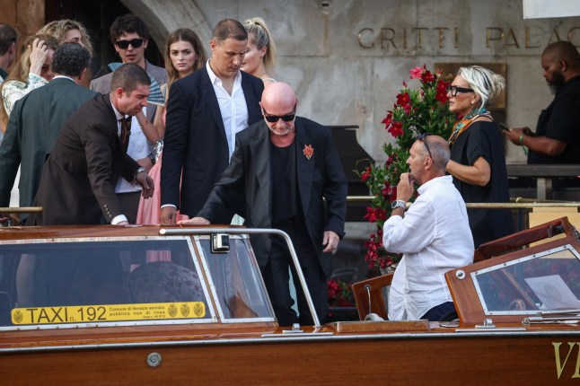Fashion designer Domenico Dolce boards a boat as he leaves Gritti Palace Hotel, ahead of the anticipated wedding of Amazon founder Jeff Bezos and Lauren Sanchez in Venice, Italy, June 26, 2025. REUTERS/Guglielmo Mangiapane