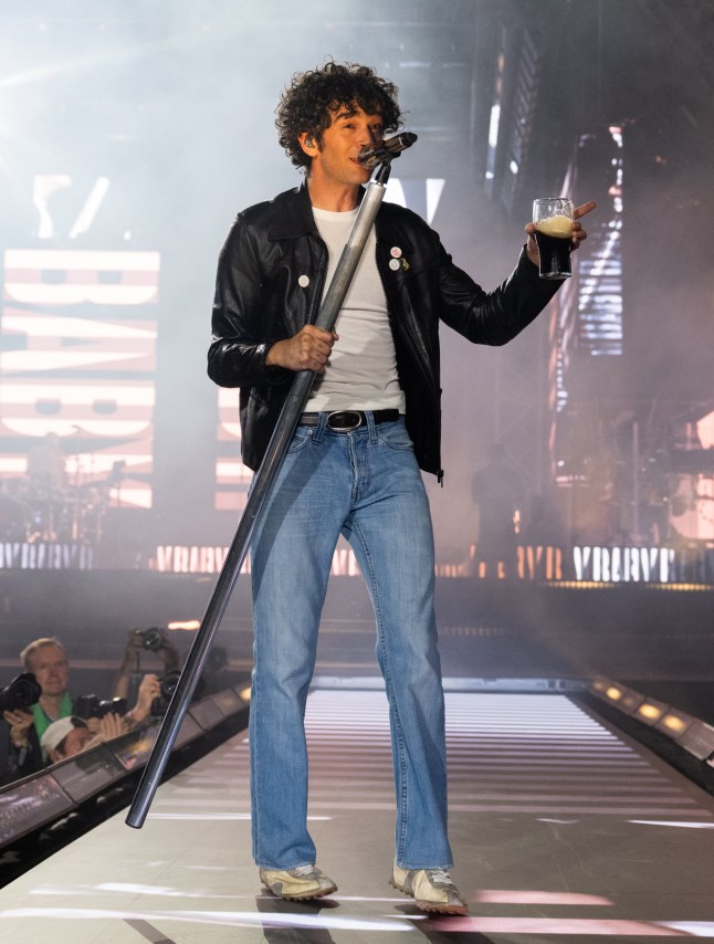 GLASTONBURY, ENGLAND - JUNE 27: Matty Healy of The 1975 performs as the band headline the Pyramid stage during day three of Glastonbury festival 2025 at Worthy Farm, Pilton on June 27, 2025 in Glastonbury, England. Established by Michael Eavis in 1970, Glastonbury has grown into the UK's largest music festival, drawing over 200,000 fans to enjoy performances across more than 100 stages. In 2026, the festival will take a fallow year, a planned pause to allow the Worthy Farm site time to rest and recover. (Photo by Samir Hussein/WireImage)