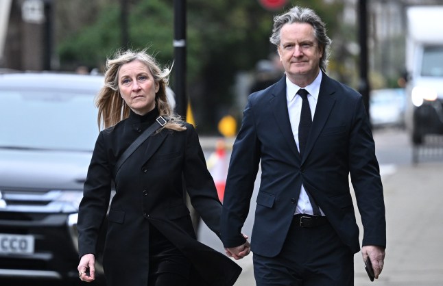 Fiona Phillips and Martin Frizell holding hands