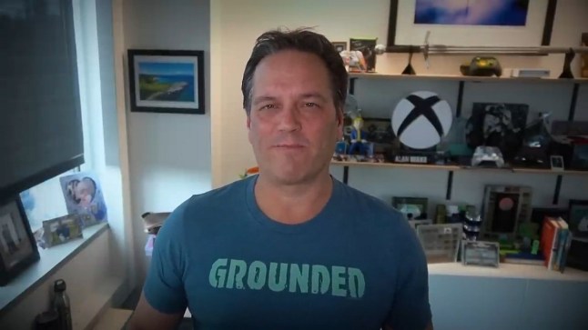 Xbox boss Phil Spencer standing in front of various Xbox paraphernalia