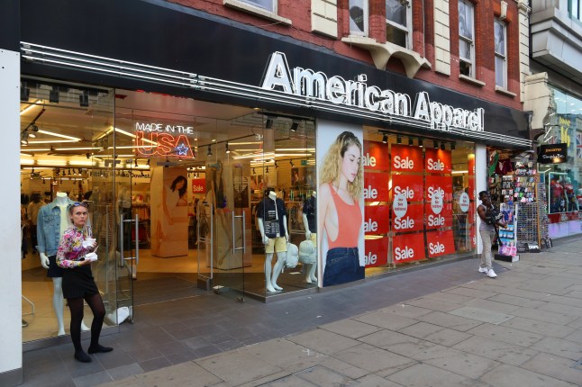 People shop at American Apparel, Oxford Street in London. Oxford Street has approximately half a million daily visitors and 320 stores.
