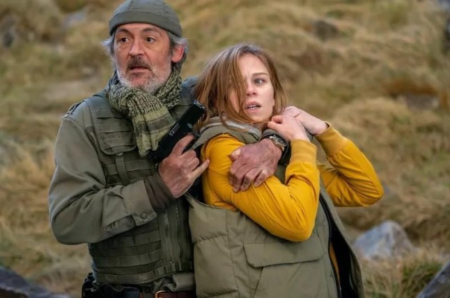 A still of a man with a gun pointing it a girl's head in The Devil's Leap
