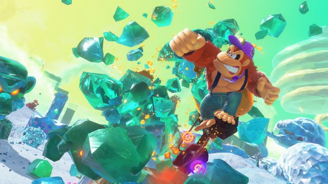 Donkey Kong Bananza: DK Island & Emerald Rush screenshot of Donkey Kong punching emeralds