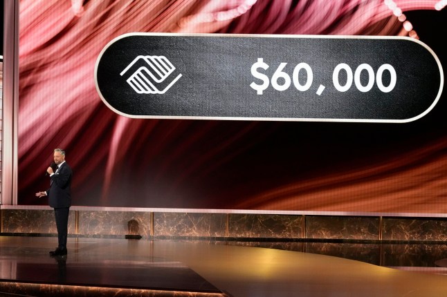 Host Nate Bargatze gives update on Girls & Boys Club donation amount during the 77th Primetime Emmy Awards on Sunday, Sept. 14, 2025, at the Peacock Theater in Los Angeles. (AP Photo/Chris Pizzello)