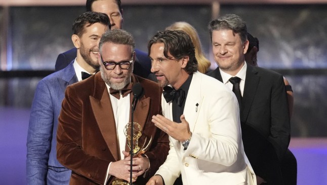 Seth Rogen, center, and the team from "The Studio" accept the award for outstanding comedy series during the 77th Primetime Emmy Awards on Sunday, Sept. 14, 2025, at the Peacock Theater in Los Angeles. (AP Photo/Chris Pizzello)