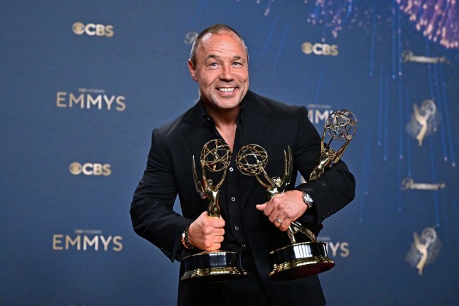 TOPSHOT - British actor Stephen Graham poses in the press room with the awards for Outstanding Limited or Anthology Series, Outstanding Lead Actor in a Limited or Anthology Series or Movie, Outstanding Writing for a Limited Series or Anthology Series or Movie for "Adolescence" during the 77th Primetime Emmy Awards at the Peacock Theatre at LA Live in Los Angeles on September 14, 2025. (Photo by Frederic J. Brown / AFP) / RESTRICTED TO EDITORIAL USE (Photo by FREDERIC J. BROWN/AFP via Getty Images)
