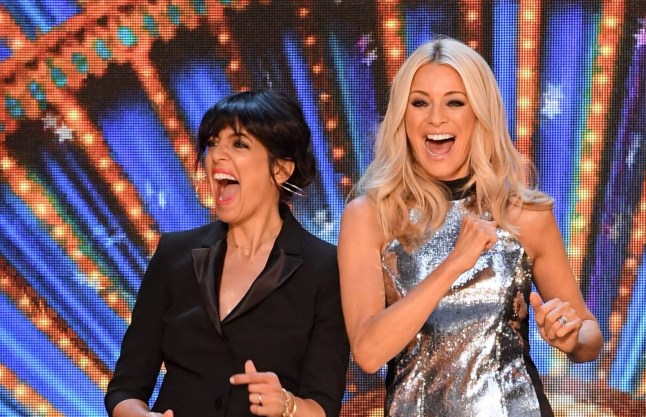 Claudia Winkleman and Tess Daly smile and laugh during an episode of Strictly Come Dancing.