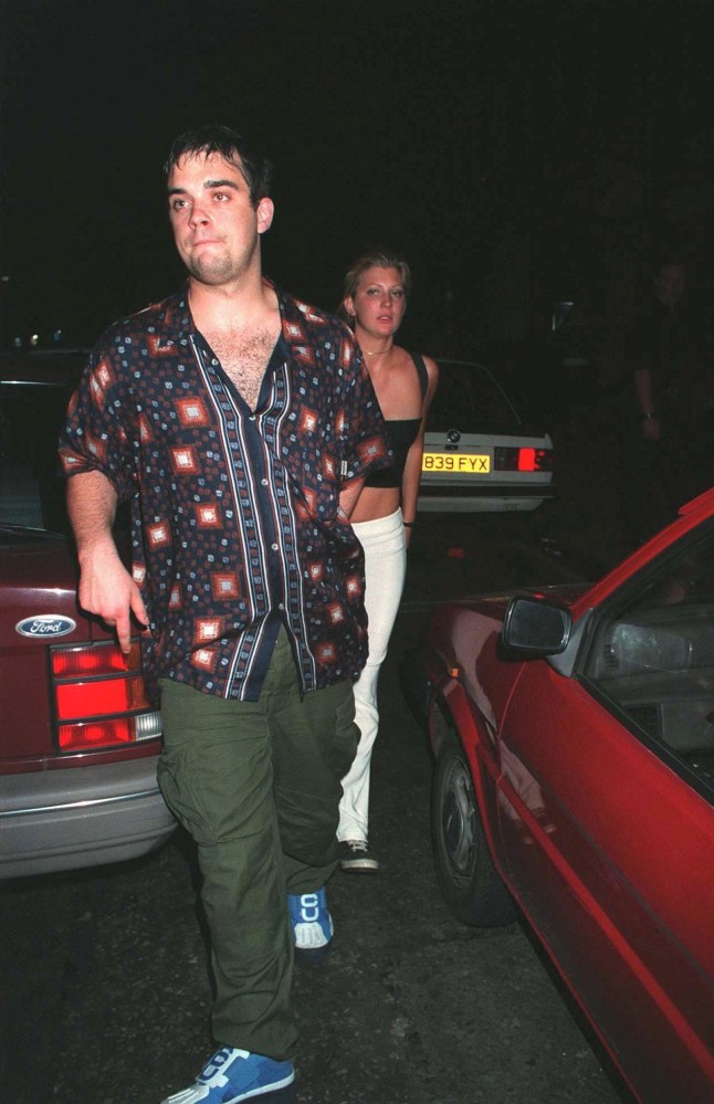 Mandatory Credit: Photo by David Abiaw/Shutterstock (274999j) ROBBIE WILLIAMS WITH MYSTERY WOMAN ROBBIE WILLIAMS WITH A MYSTERY GIRLFRIEND LEAVING HANOVER GRAND, LONDON, BRITAIN - 1999