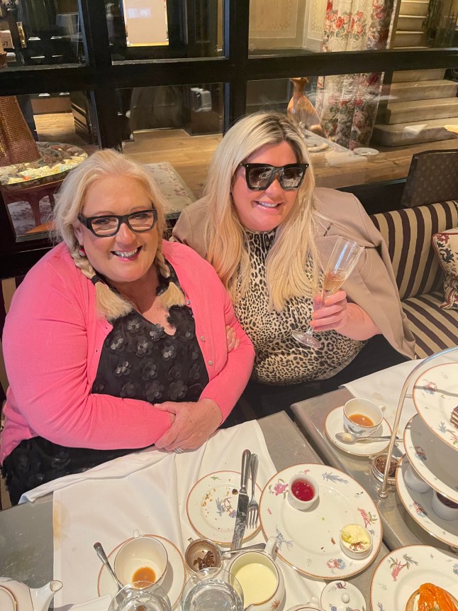 Gemma (right) and Joan Collins sit together at table