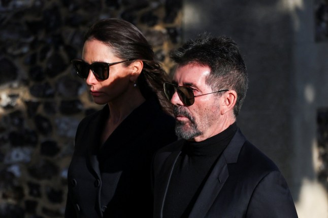 Simon Cowell and his wife Lauren Silverman walk on the day of the funeral of former One Direction singer Liam Payne at St. Mary's Church in Amersham, near London, Britain, November 20, 2024. REUTERS/Toby Melville