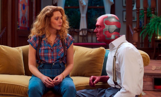 This image released by Disney+ shows Elizabeth Olsen, left and Paul Bettany in a scene from "WandaVision." (Disney+ via AP)