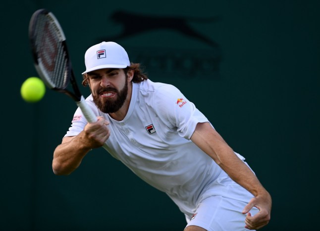 LONDON, ENGLAND - JUNE 27: Reilly Opelka of The United States plays a forehand against Carlos Taberner of Spain during the Men's Singles First Round match during Day One of The Championships Wimbledon 2022 at All England Lawn Tennis and Croquet Club on June 27, 2022 in London, England. (Photo by Justin Setterfield/Getty Images)