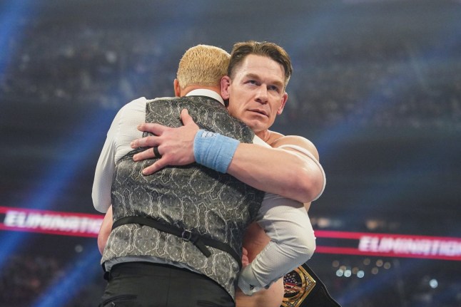 John Cena hugs Cody Rhodes and looks threatening during his heel turn at WWE Elimination Chamber