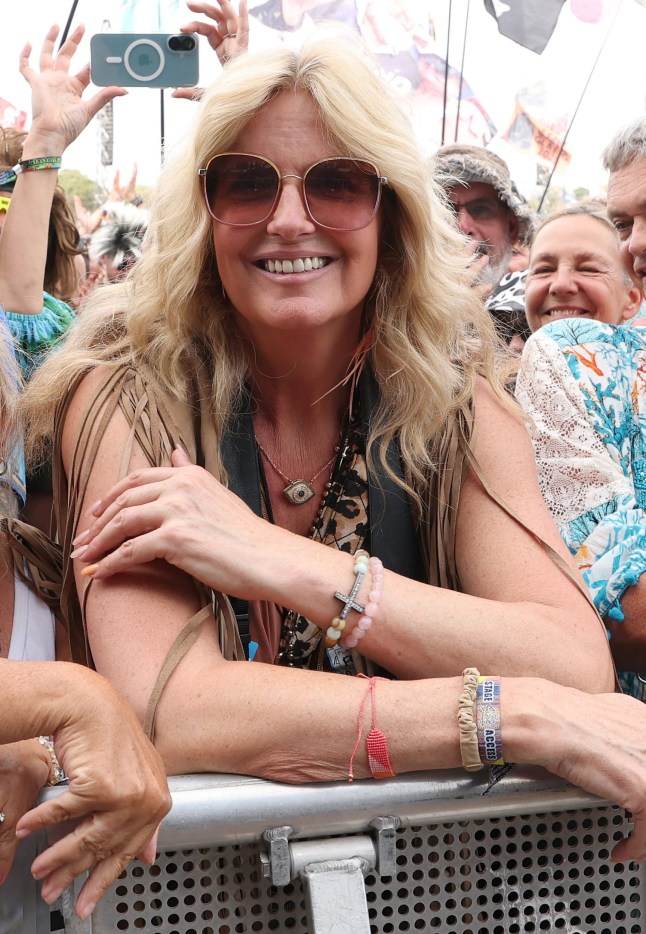 GLASTONBURY, ENGLAND - JUNE 29: (EDITOR'S NOTE: EDITORIAL USE ONLY - STRICTLY NO COMMERCIAL USE - NO USE IN PUBLICATION SOLELY OF ROD STEWART) Penny Lancaster smiles as she watches Rod Stewart perform onstage during day five of the Glastonbury Festival 2025 at Worthy Farm, Pilton on June 29, 2025 in Glastonbury, England. Established by Michael Eavis in 1970, Glastonbury has grown into the UK's largest music festival, drawing over 200,000 fans to enjoy performances across more than 100 stages. In 2026, the festival will take a fallow year, a planned pause to allow the Worthy Farm site time to rest and recover. (Photo by Kevin Mazur/Getty Images)