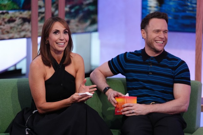 Olly Murrs holds a box of tissues for Alex Jones, as she reacts to a message from her children during her 15th anniversary of presenting The One Show, in the studio at BBC Broadcasting House in central London. Jones, 48, who started out in children's TV, joined the BBC weekday chat show in August 2010 and hosted major events including royal weddings, Sport Relief and Eurovision. Picture date: Friday August 8, 2025. PA Photo. Photo credit should read: Jonathan Brady/PA Wire