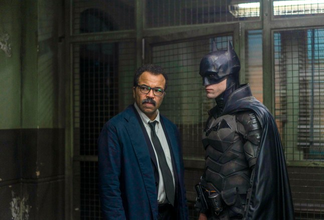 *LIGHTENED* This image released by Warner Bros. Pictures shows Jeffrey Wright, left, and Robert Pattinson in a scene from "The Batman." (Jonathan Olley/Warner Bros. Pictures via AP)