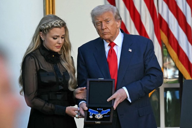 US President Donald Trump and Erika Kirk (L), Charlie Kirk's widow, participate in a Medal of Freedom Ceremony for late US right-wing activist Charlie Kirk in the Rose Garden of the White House in Washington, DC, on October 14, 2025. Kirk was shot dead on a Utah college campus on September 10, 2025, sparking a wave of grief among conservatives, and threats of a clampdown on the "radical left" from President Donald Trump. (Photo by ANDREW CABALLERO-REYNOLDS / AFP) (Photo by ANDREW CABALLERO-REYNOLDS/AFP via Getty Images)