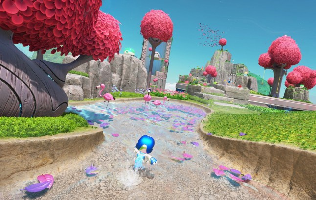 Screenshot of Astro Bot on PS5 running through water in grassy land
