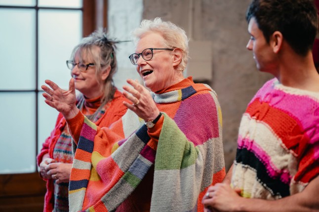 Judges Di Gilpin and Sheila Greenwell with Presenter Tom Daley, judging in The Yarn Barn