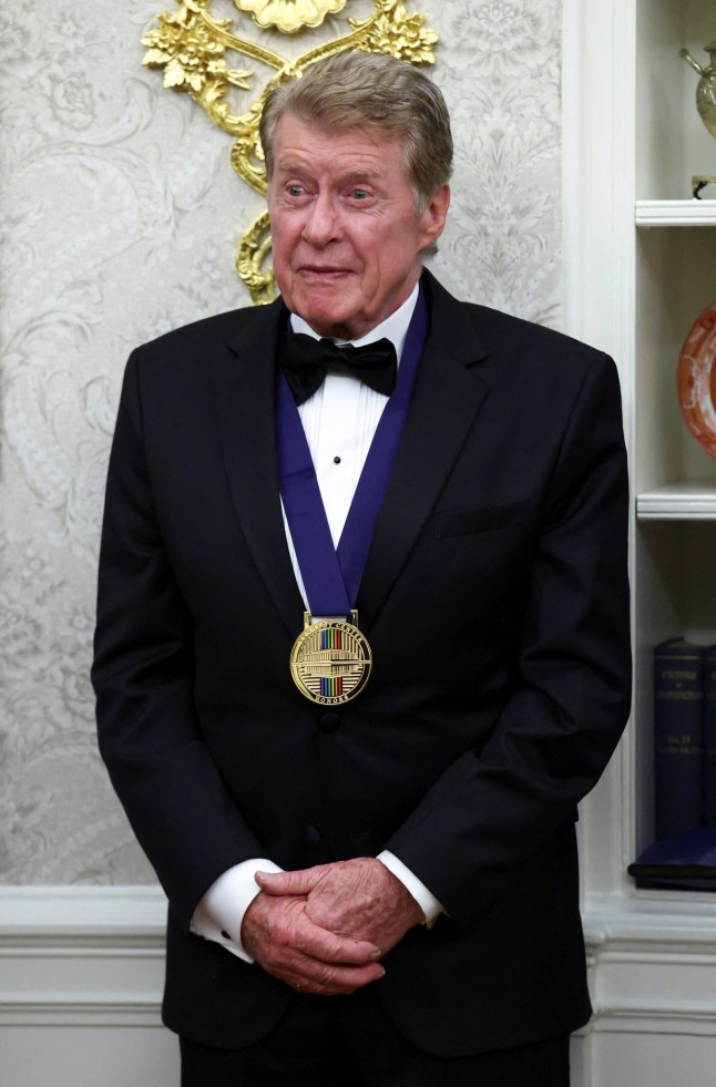 Kennedy Center Honors recipient actor Michael Crawford stands after receiving a medal from U.S. President Donald Trump during the Kennedy Centre Honours medal presentation ahead of tomorrow's ceremony, in the Oval Office of the White House in Washington, D.C., December 6, 2025. REUTERS/Kevin Lamarque