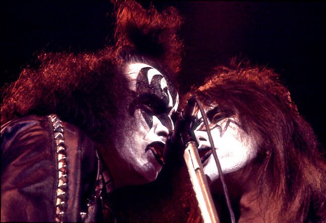 American bass player and vocalist Gene Simmons (left) and guitarist Ace Frehley of the rock band Kiss perform on stage at the Chicago Stadium