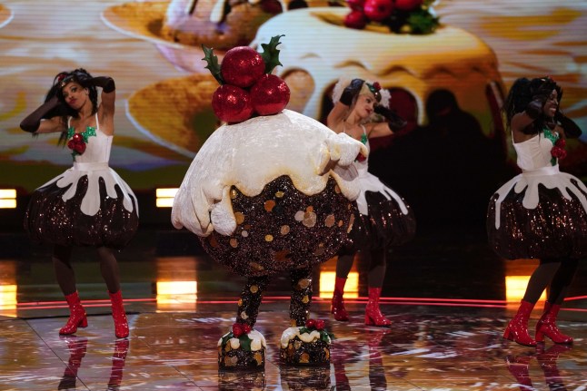 This image and the information contained herein is strictly embargoed until 20.00 Sunday 14 December 2025 From Bandicoot TV The Masked Singer: SR7: Christmas on ITV1 and ITVX Pictured: Figgy Pudding. This photograph is (C) Bandicoot TV and can only be reproduced for editorial purposes directly in connection with the programme or event mentioned above, or ITV plc. This photograph must not be manipulated [excluding basic cropping] in a manner which alters the visual appearance of the person photographed deemed detrimental or inappropriate by ITV plc Picture Publicity. This photograph must not be syndicated to any other company, publication or website, or permanently archived, without the express written permission of ITV Picture Publicity. Full Terms and conditions are available on the website www.itv.com/presscentre/itvpictures/terms