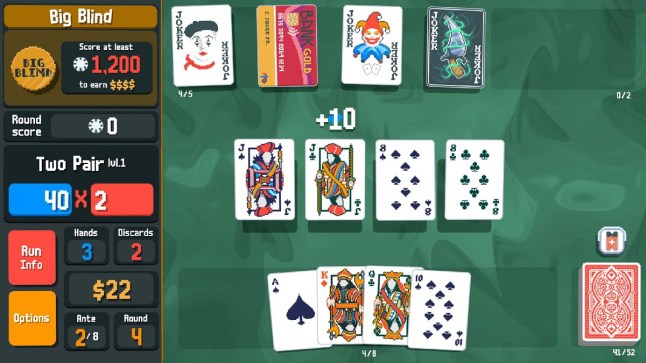 Balatro gameplay of playing cards resting on a green tabletop