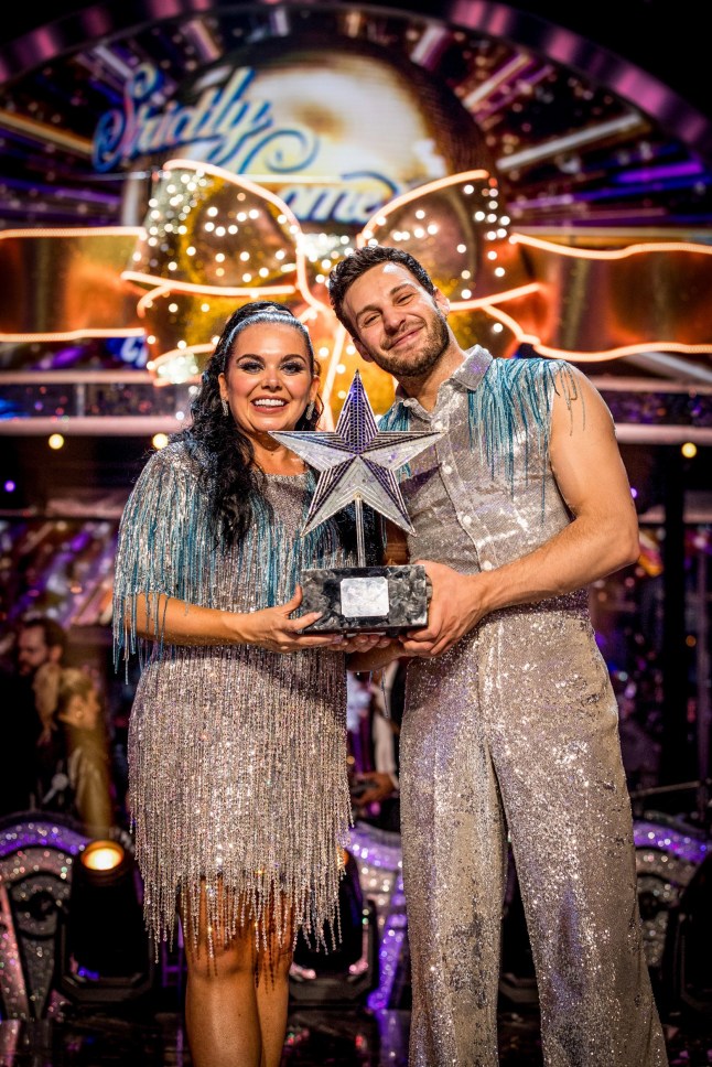 For use in UK, Ireland or Benelux countries only BBC handout photo of Scarlett Moffatt & Vito Coppola holding the winning trophy on the BBC1's Strictly Come Dancing Christmas Special 2025. Issue date: Thursday December 25, 2025. PA Photo. Photo credit should read: Guy Levy/BBC/PA Wire NOTE TO EDITORS: Not for use more than 21 days after issue. You may use this picture without charge only for the purpose of publicising or reporting on current BBC programming, personnel or other BBC output or activity within 21 days of issue. Any use after that time MUST be cleared through BBC Picture Publicity. Please credit the image to the BBC and any named photographer or independent programme maker, as described in the caption.