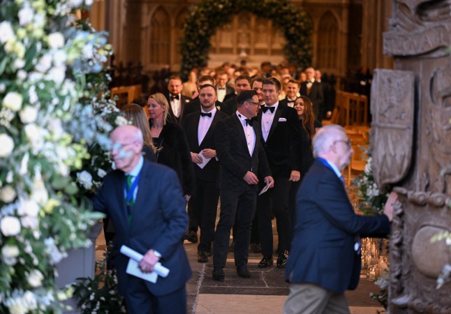 Guests leave the wedding of Adam Peaty and Holly Ramsay at Bath Abbey on December 27, 2025